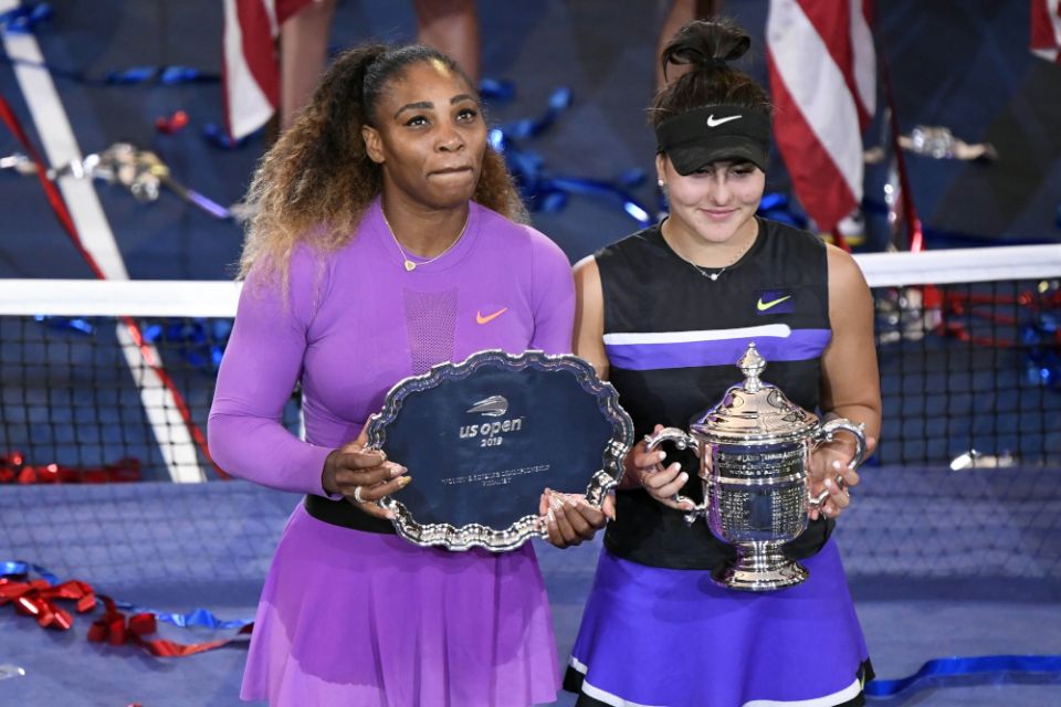 Serena Williams of the United States and Bianca Andreescu of Canada pose with the second-place and first-place trophies after Andreescu won the women's singles final on day thirteen of the U.S. Open tennis tournament Sept. 7, 2019 (CNS/USA TODAY Sports)