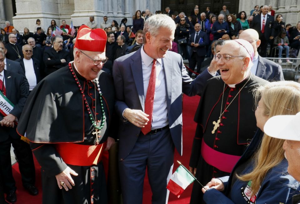 New York City Mayor Bill de Blasio shares a light moment with New York Cardinal Timothy Dolan, left, and Bishop Nicholas DiMarzio of Brooklyn, New York, outside St. Patrick's Cathedral during the Columbus Day Parade in New York City Oct. 14, 2019. (CNS)