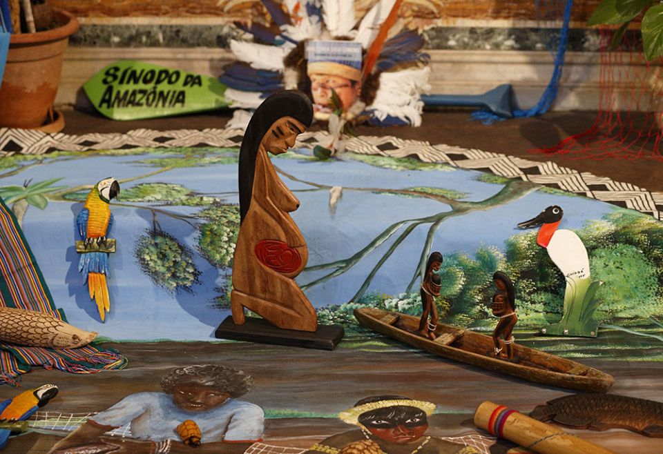 A wooden statue of a pregnant woman, often referred to as "Pachamama," is pictured in the Church of St. Mary in Traspontina as part of exhibits on the Amazon region during the Synod of Bishops for the Amazon in Rome Oct. 18, 2019. (CNS/Paul Haring)