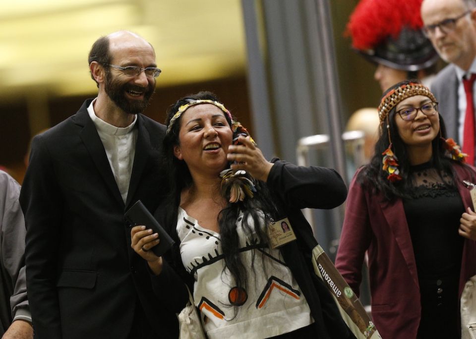 Yésica Patiachi, second from left, leaves the final session of the Synod of Bishops for the Amazon at the Vatican Oct. 26, 2019, with Comboni Fr. Dario Bossi of Brazil and Leah Casimero of Guyana. (CNS/Paul Haring) 