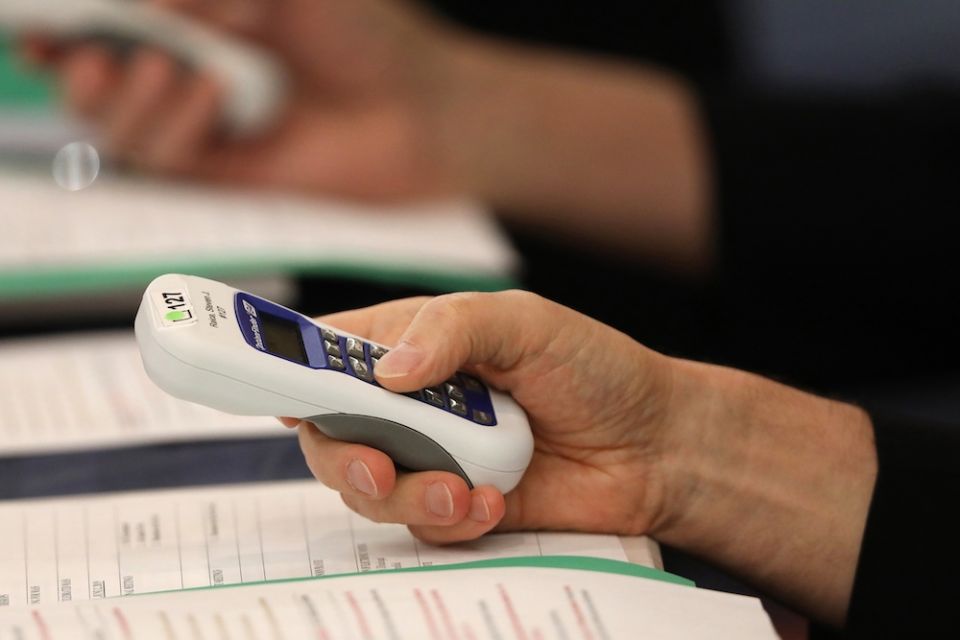 Bishops use electronic voting devices during the spring general assembly of the U.S. Conference of Catholic Bishops June 12, 2019, in Baltimore. During the 2021 virtual spring assembly, bishops voted by secret ballot June 17 to draft a document to address Bishops use electronic voting devices during the spring general assembly of the U.S. Conference of Catholic Bishops June 12, 2019, in Baltimore. During the 2021 virtual spring assembly, bishops voted by secret ballot June 17 to draft a document to address