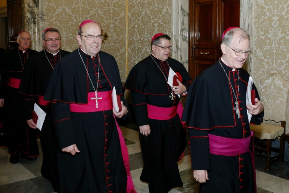 U.S. bishops from the state of New York walk through the Apostolic Palace after meeting Pope Francis at the Vatican Nov. 15. (CNS/Paul Haring)