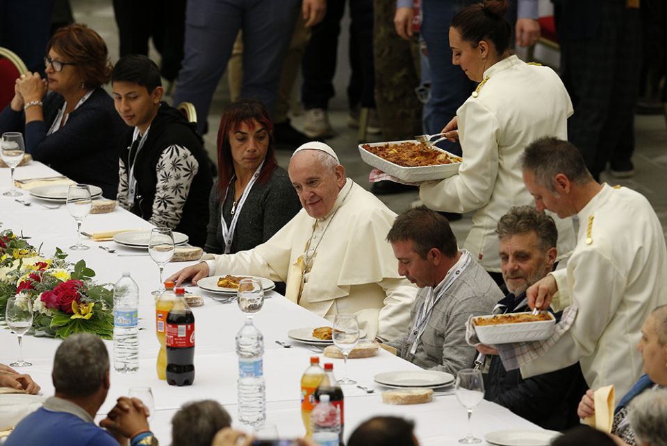 Pope Francis eats lunch with the poor in the Paul VI hall as he marks World Day of the Poor Nov. 17, 2019, at the Vatican. (CNS/Paul Haring)