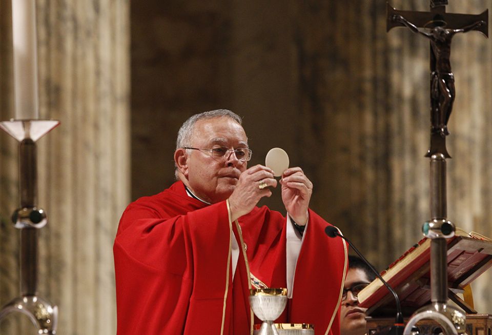 Archbishop Charles Chaput elevates the Eucharist as U.S. bishops from New Jersey and Pennsylvania concelebrate Mass at the Basilica of St. Paul Outside the Walls in Rome Nov. 27, 2019. (CNS/Robert Duncan)