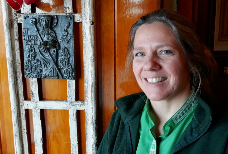 Shanon Sterringer is seen alongside an image of St. Hildegard of Bingen at Hildegard Haus, the church community she leads as a Roman Catholic woman priest in Fairport Harbor, Ohio. (Don Clemmer) Shanon Sterringer is seen alongside an image of St. Hildegard of Bingen at Hildegard Haus, the church community she leads as a Roman Catholic woman priest in Fairport Harbor, Ohio. (Don Clemmer)