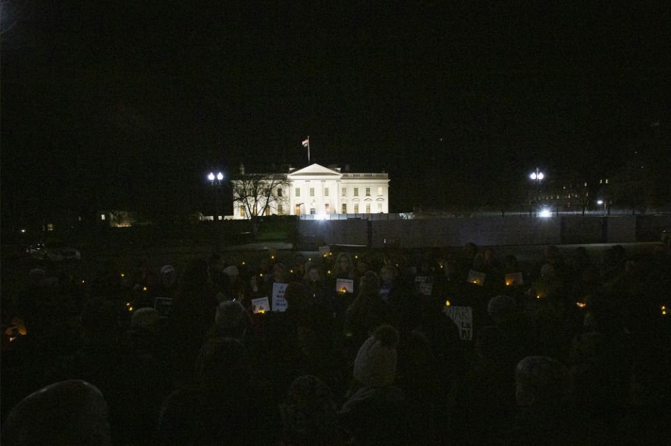 People gather near the White House Jan. 6 in Washington during a candlelight vigil to call for peaceful solutions to rising tensions between the United States and Iran. (CNS/Tyler Orsburn)