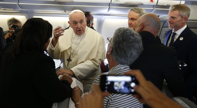 Pope Francis greets journalists aboard his flight from Rome to Maputo, Mozambique, Sept. 4, 2019. (CNS/Paul Haring)