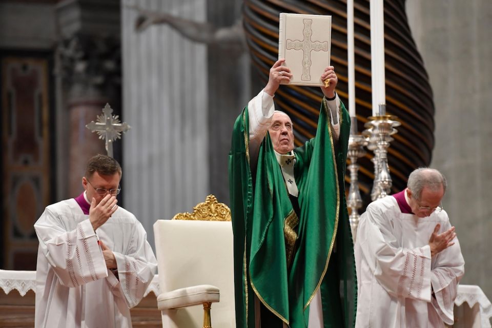 Pope Francis holds up the Lectionary used during Vatican II Pope Francis holds up the Lectionary (or book of Mass readings) that was used during the Second Vatican Council, Jan. 26, 2020, in St. Peter's Basilica, the first Sunday of the Word of God, encouraging Catholics to read the Bible. (CNS/Vatican Media)