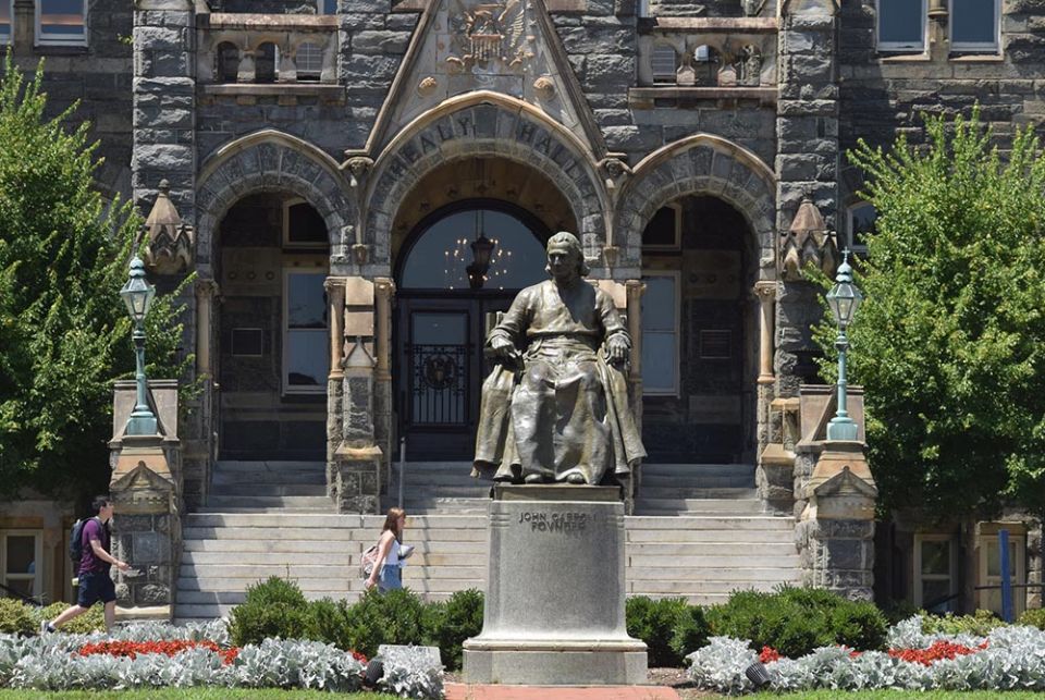 This statue of Georgetown University's founder, Bishop John Carroll, greets students at the Washington campus entrance July 22, 2019. (CNS/Elizabeth Bachmann)