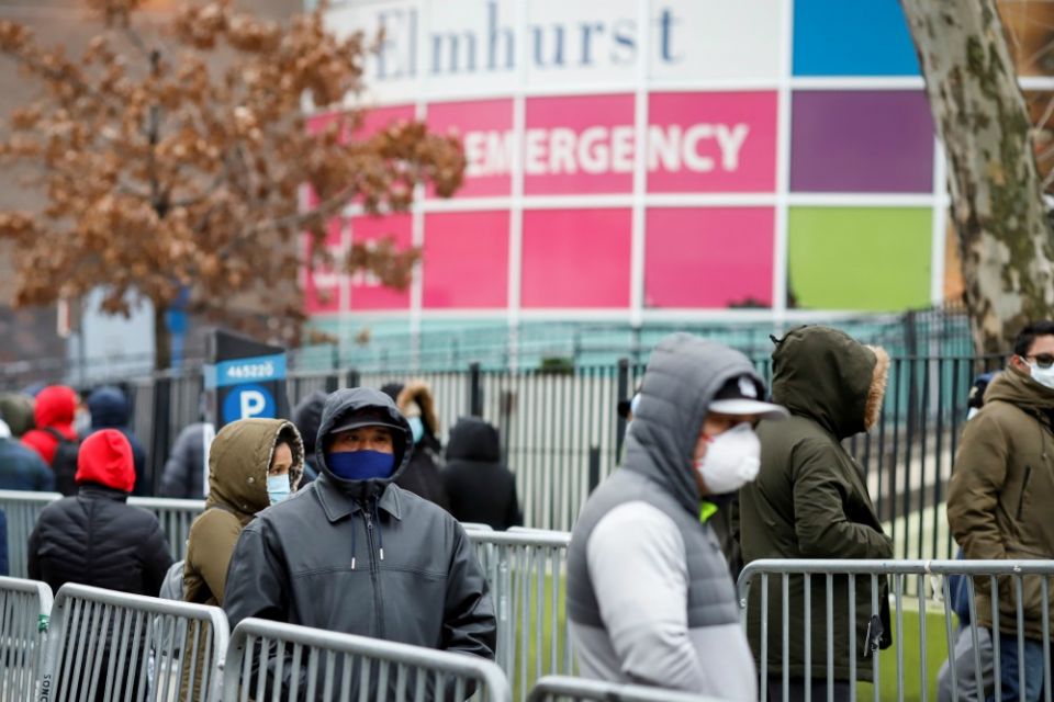 People wearing protective gear wait in line to be tested for the coronavirus (COVID-19) outside Elmhurst Hospital Center in the Queens borough of New York City March 25. (CNS/Reuters/Stefan Jeremiah) People wearing protective gear wait in line to be tested for the coronavirus (COVID-19) outside Elmhurst Hospital Center in the Queens borough of New York City March 25. (CNS/Reuters/Stefan Jeremiah)