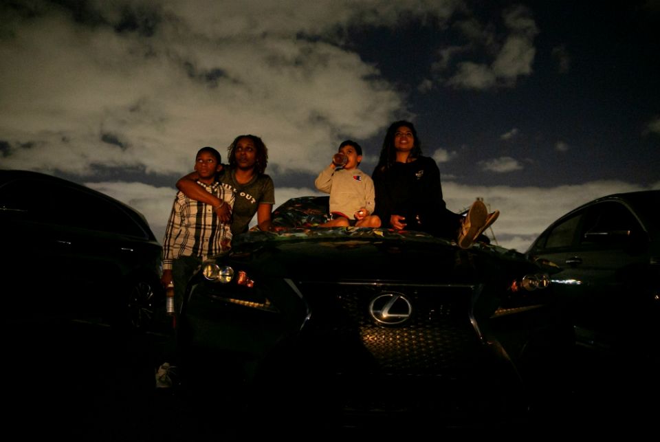 People in Fort Lauderdale, Florida, watch a movie at a drive-in theater during the coronavirus pandemic March 28. (CNS/Reuters/Marco Bello)