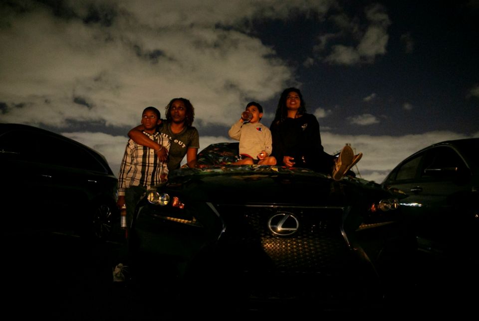 People in Fort Lauderdale, Florida, watch a movie at a drive-in theater during the coronavirus pandemic March 28. (CNS/Reuters/Marco Bello) People in Fort Lauderdale, Florida, watch a movie at a drive-in theater during the coronavirus pandemic March 28. (CNS/Reuters/Marco Bello)