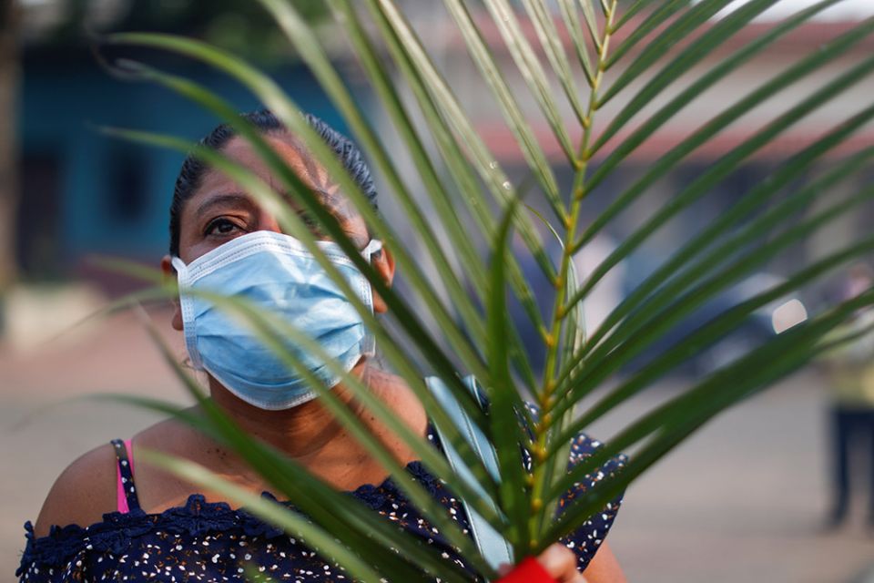 A woman attends a Palm Sunday procession in Nahuizalco, El Salvador, April 5, 2020. (CNS/Reuters/Jose Cabezas)