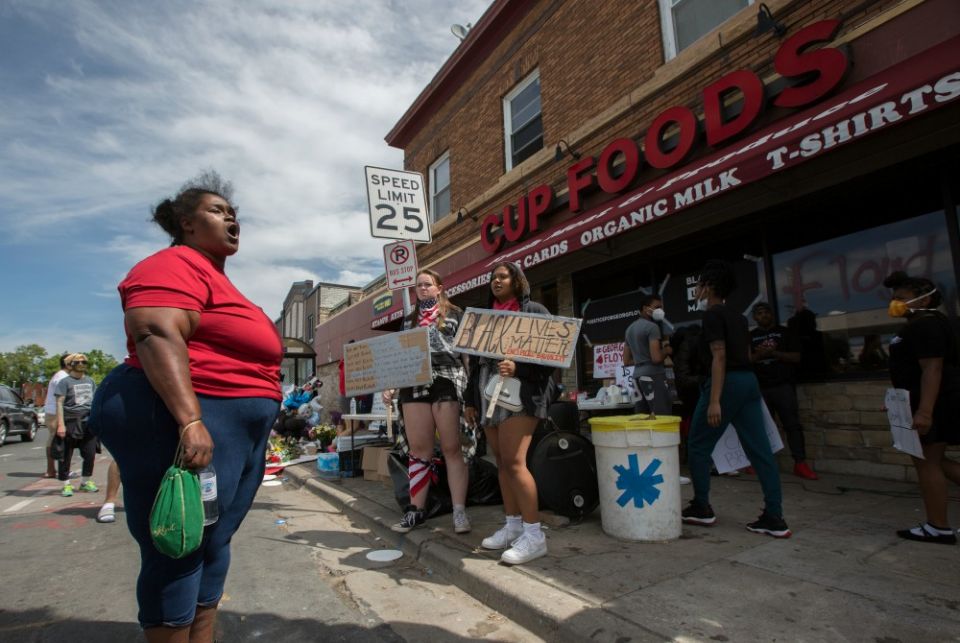 A woman in Minneapolis expresses her anger and frustration May 28 at the site where George Floyd was pinned down May 25 by a police officer. Floyd later died at a local hospital. (CNS/The Catholic Spirit/Dave Hrbacek) A woman in Minneapolis expresses her anger and frustration May 28 at the site where George Floyd was pinned down May 25 by a police officer. Floyd later died at a local hospital. (CNS/The Catholic Spirit/Dave Hrbacek)