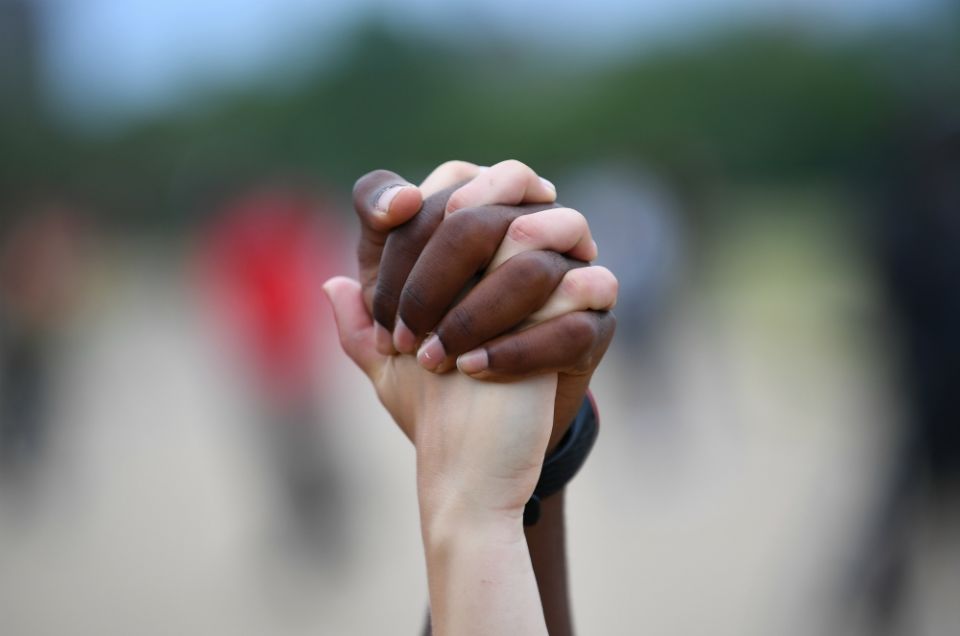 A man and woman hold hands in London's Hyde Park during a Black Lives Matter protest June 3. (CNS/Reuters/Dylan Martinez) A man and woman hold hands in London's Hyde Park during a Black Lives Matter protest June 3. (CNS/Reuters/Dylan Martinez)