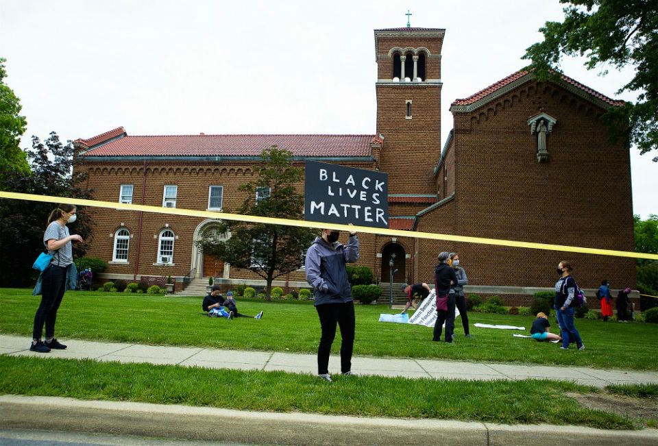 A demonstrator holds a "Black Lives Matter" sign in Washington June 2. (CNS/Tyler Orsburn) A demonstrator holds a "Black Lives Matter" sign in Washington June 2. (CNS/Tyler Orsburn)