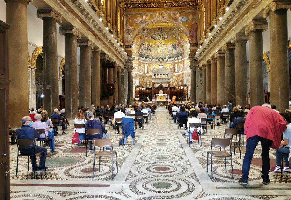 People are seen inside Rome's Basilica of Santa Maria in Trastevere June 5, 2020, before a prayer vigil for peaceful coexistence in the United States. (CNS/Junno Arocho Esteves)