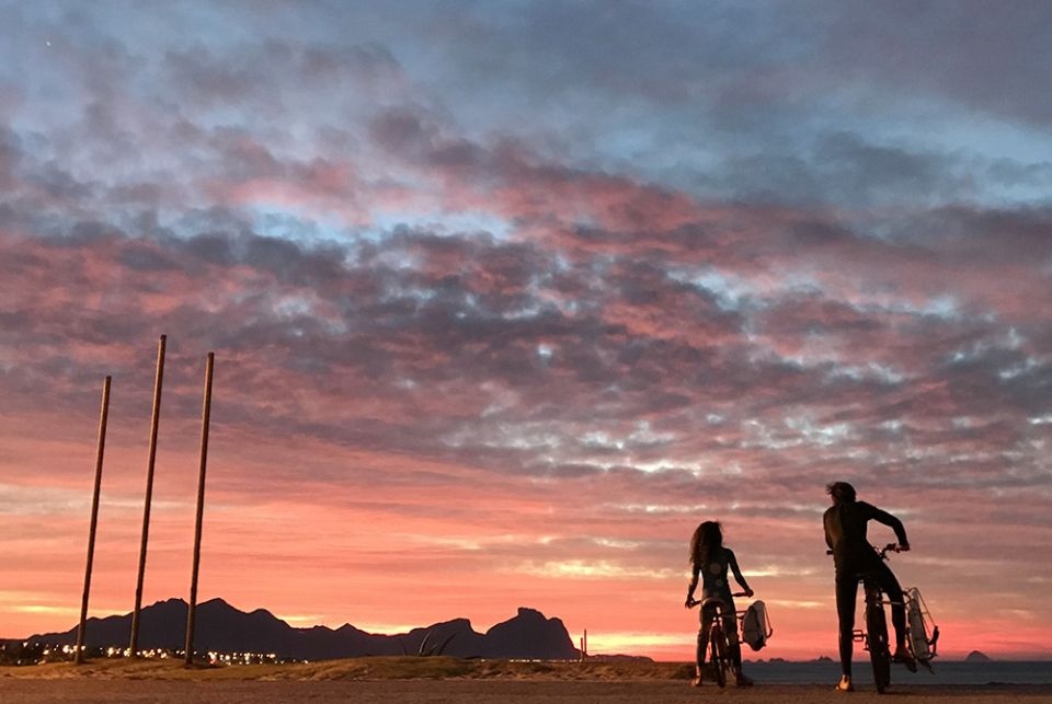 Sunrise along a beach July 1, 2020, in Rio de Janeiro A father and his daughter are seen during a sunrise along a beach July 1, 2020, in Rio de Janeiro. Brazil is struggling to deal with the needs of more than 130,000 children who have been made orphans amid the COVID-19 pandemic. (CNS/Reuters/Sergio Morae