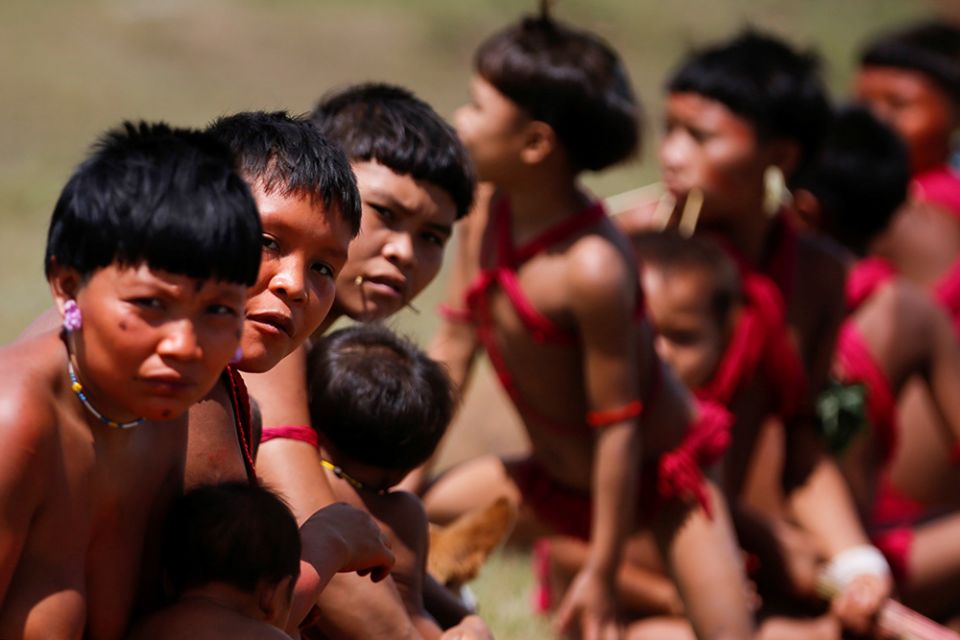 Young Yanomami look on as members of a medical team with the Brazilian army examine members of the Indigenous tribe in the state of Roraima July 1, 2020, during the COVID-19 pandemic. (CNS/Reuters/Adriano Machado) Young Yanomami look on as members of a medical team with the Brazilian army examine members of the Indigenous tribe in the state of Roraima July 1, 2020, during the COVID-19 pandemic. (CNS/Reuters/Adriano Machado)