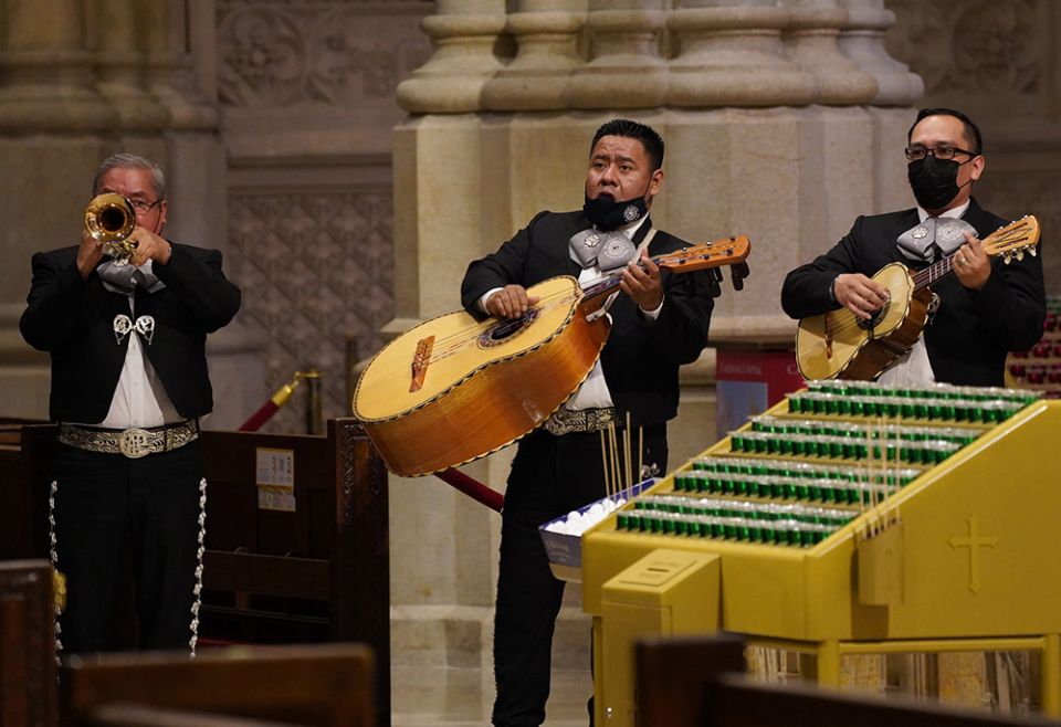 A mariachi band provides music for a July 11, 2020, prayer service at St. Patrick's Cathedral in New York City during which New York Cardinal Timothy Dolan blessed the cremated remains of 250 Mexicans who had died from COVID-19. (CNS/Gregory A. Shemitz) A mariachi band provides music for a July 11, 2020, prayer service at St. Patrick's Cathedral in New York City during which New York Cardinal Timothy Dolan blessed the cremated remains of 250 Mexicans who had died from COVID-19. (CNS/Gregory A. Shemitz)