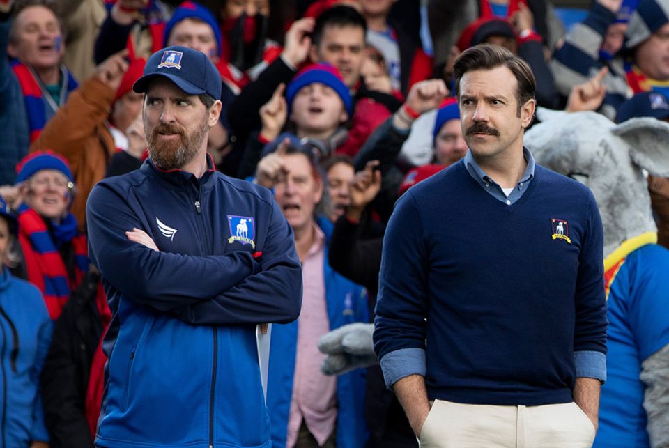 Jason Sudeikis, right, appears with Brendan Hunt in a scene from the TV show "Ted Lasso" streaming on Apple TV+. (CNS/Apple TV )