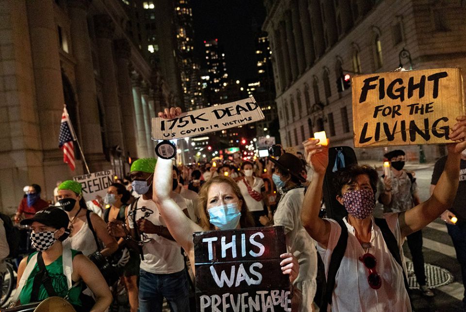 Demonstrators in New York City protest the Trump administration's handling of the coronavirus pandemic Aug. 21. (CNS/Jeenah Moon, Reuters)