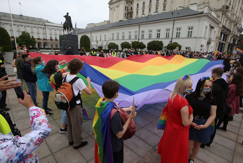 Demonstrators hold a giant rainbow flag during a protest against hatred toward LGBT people Aug. 30, 2020, in Warsaw, Poland. (CNS/Kuba Atys, Agencja Gazeta via Reuters)