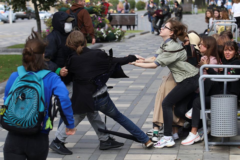 A plainclothes law enforcement officer tries to detain a student during a protest against presidential election results Sept. 1 in Minsk, Belarus. (CNS/Tut.By via Reuters)