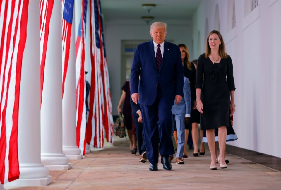 President Donald Trump arrives at the White House Rose Garden with federal Judge Amy Coney Barrett Sept. 26 to nominate her to fill the U.S. Supreme Court vacancy. (CNS/Reuters/Carlos Barria) President Donald Trump arrives at the White House Rose Garden with federal Judge Amy Coney Barrett Sept. 26 to nominate her to fill the U.S. Supreme Court vacancy. (CNS/Reuters/Carlos Barria)