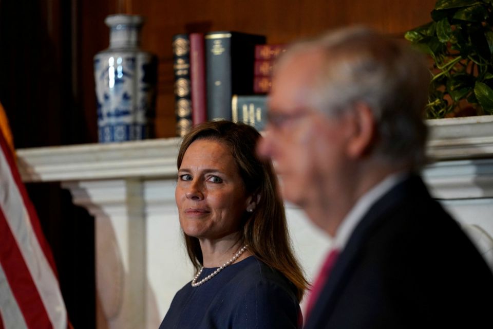 Judge Amy Coney Barrett, President Donald Trump's nominee for the U.S. Supreme Court, meets with Senate Majority Leader Mitch McConnell, R-Kentucky, on Capitol Hill in Washington Sept. 29. (CNS/Susan Walsh, Pool via Reuters)