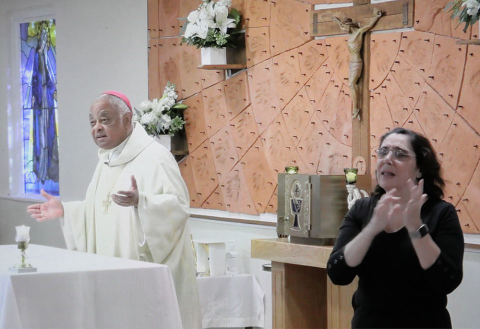 Washington Archbishop Wilton Gregory celebrates the White Mass at St. Francis Deaf Catholic Church Oct. 18, 2020, in Landover Hills, Maryland. Mary O'Meara interpreted the Mass in American Sign Language. (CNS/Screengrab via Catholic Standard) Washington Archbishop Wilton Gregory celebrates the White Mass at St. Francis Deaf Catholic Church Oct. 18, 2020, in Landover Hills, Maryland. Mary O'Meara interpreted the Mass in American Sign Language. (CNS/Screengrab via Catholic Standard)