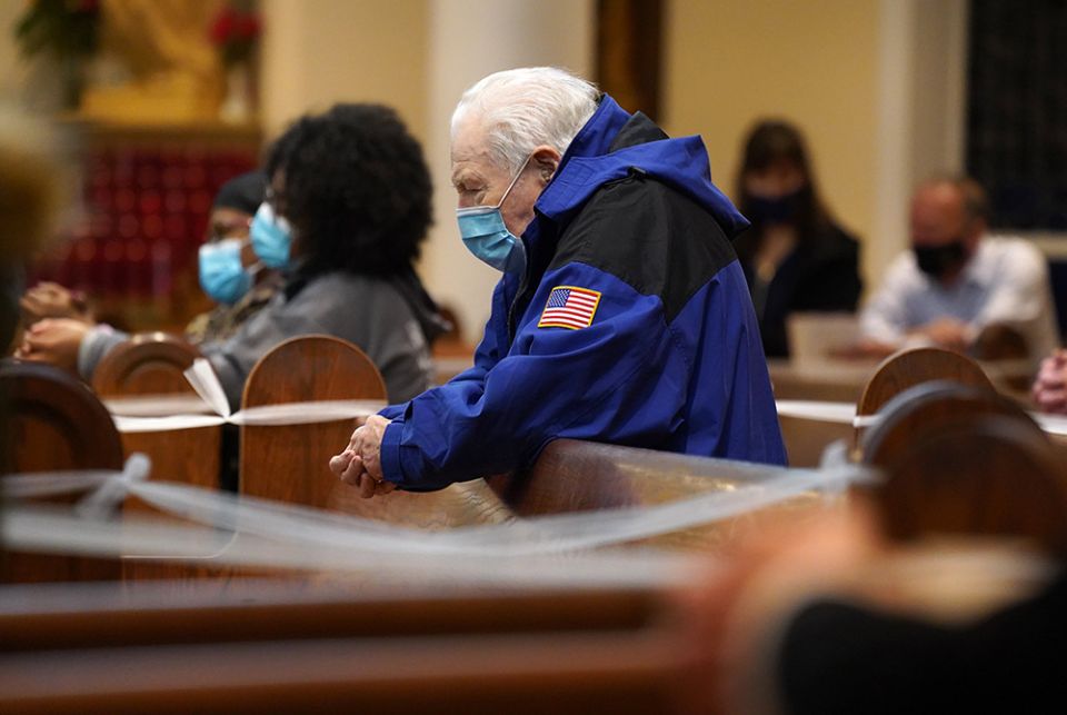 Ignatius Rienzo, a Knight of Columbus, prays during a special Holy Hour celebrated Nov. 1, to offer prayers for the nation two days before Election Day at St. Patrick Church in Smithtown, New York. The service was organized by the parish's Legion of Mary 