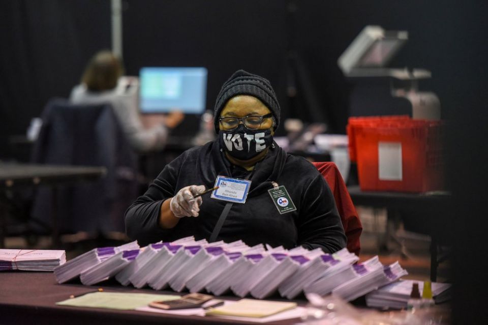 An election worker in Houston processes mail-in ballots Nov. 2, 2020. Election Day was Nov. 3. (CNS/Callaghan O'Hare, Reuters)