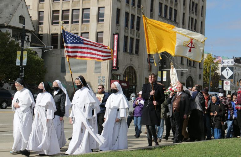 Women religious and other Catholics in Detroit march during a Unite Our Nation procession Oct. 31. (CNS/Detroit Catholic/Dan Meloy)