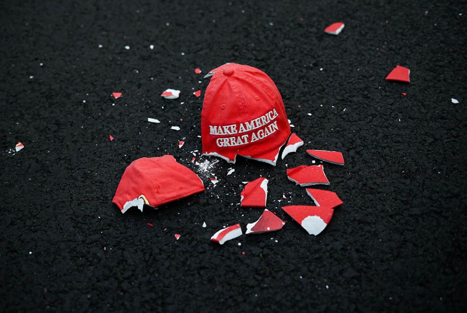 A ceramic "Make America Great Again" hat lies broken on the ground as people gather at Black Lives Matter Plaza in Washington Nov. 3. (CNS/Hannah McKay, Reuters)
