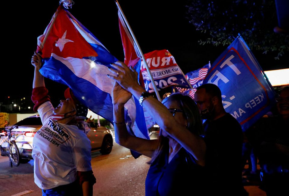 A supporter of President Donald Trump holds a Cuban flag in Miami during the presidential election Nov. 3, 2020. (CNS/Reuters/Marco Bello)