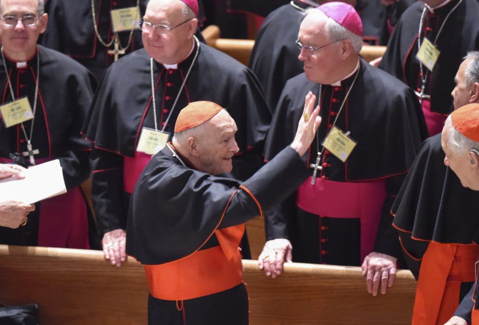 Then-Cardinal Theodore McCarrick waves to fellow bishops as he attends a prayer service with Pope Francis and more than 300 U.S. bishops at the Cathedral of St. Matthew the Apostle in Washington Sept. 23, 2015. (CNS)