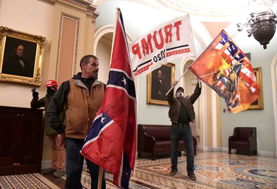Supporters of President Donald Trump demonstrate on the second floor of the U.S. Capitol building in Washington near the entrance to the Senate after breaching security defenses Jan. 6. (CNS/Reuters/Mike Theiler) Supporters of President Donald Trump demonstrate on the second floor of the U.S. Capitol building in Washington near the entrance to the Senate after breaching security defenses Jan. 6. (CNS/Reuters/Mike Theiler)
