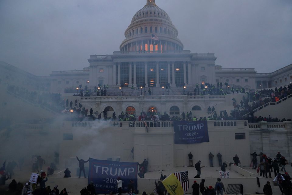 Police officers in Washington stand guard Jan. 6, 2021, as supporters of President Donald Trump gather in front of the U.S. Capitol. (CNS/Leah Millis, Reuters)