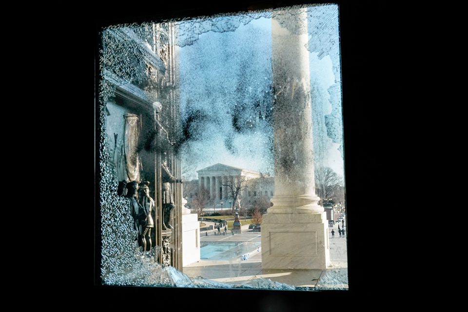 The U.S. Supreme Court is seen through a smashed glass door at the U.S. Capitol in Washington Jan. 7, one day after supporters of President Donald Trump stormed Capitol Hill. (CNS/Reuters/Erin Scott)