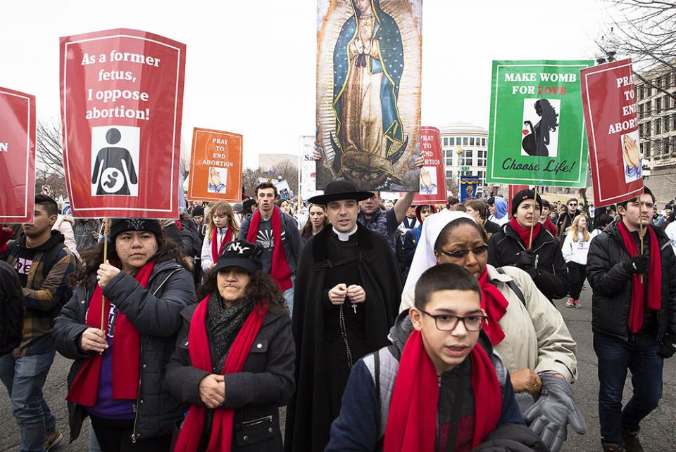 People walk up Constitution Avenue headed toward the U.S. Supreme Court while participating in the 47th annual March for Life Jan. 24, 2020, in Washington. The 2021 March for Life in Washington will be held virtually because of the coronavirus pandemic an People walk up Constitution Avenue headed toward the U.S. Supreme Court while participating in the 47th annual March for Life Jan. 24, 2020, in Washington. The 2021 March for Life in Washington will be held virtually because of the coronavirus pandemic an