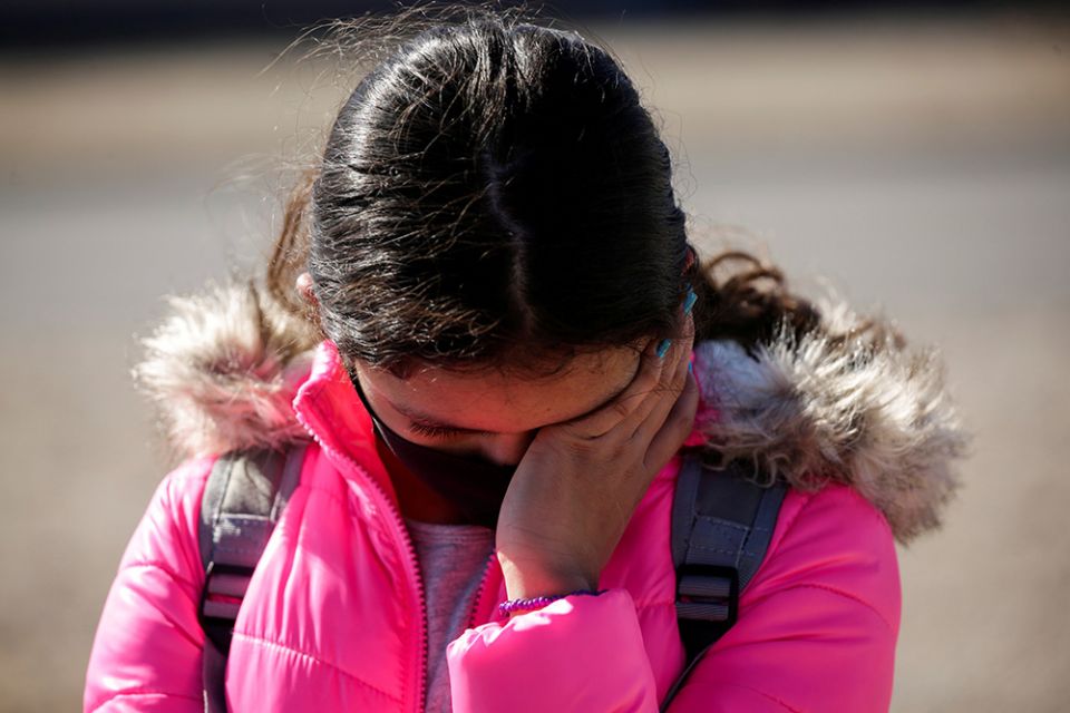 A migrant girl from Central America cries before crossing the Rio Bravo with her family in Ciudad Juárez, Mexico, Feb. 5 to request asylum in El Paso, Texas. (CNS/Reuters/Jose Luis Gonzalez) A migrant girl from Central America cries before crossing the Rio Bravo with her family in Ciudad Juárez, Mexico, Feb. 5 to request asylum in El Paso, Texas. (CNS/Reuters/Jose Luis Gonzalez)