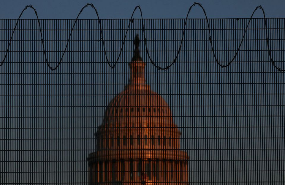 The U.S. Capitol is seen in Washington Jan. 28 behind steel fencing topped with razor wire. (CNS/Reuters/Leah Millis)
