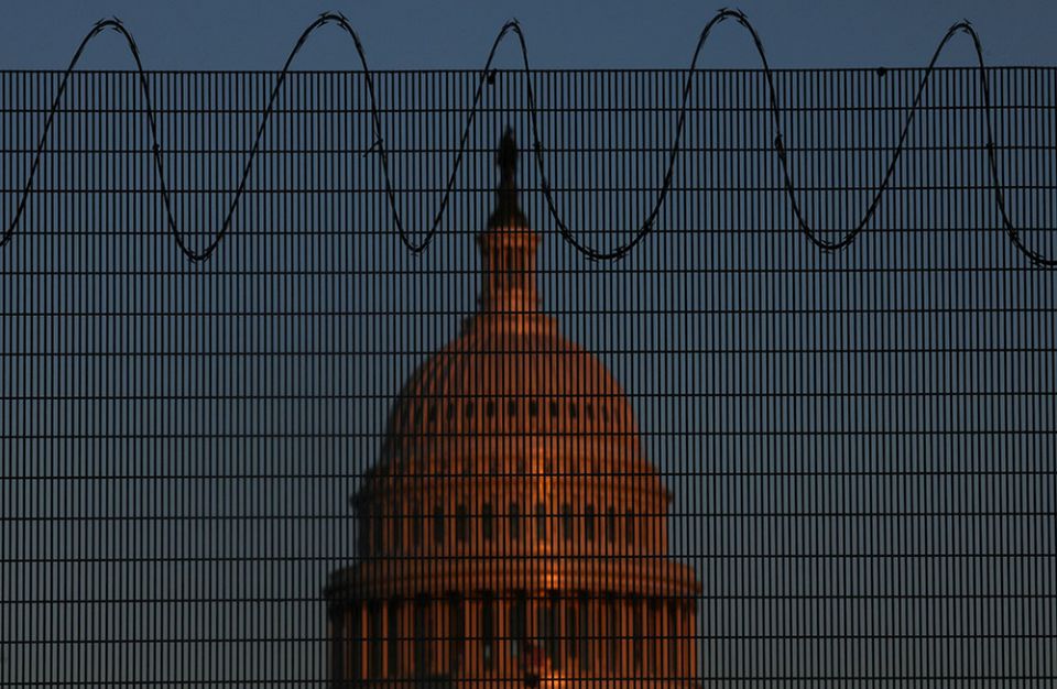 The U.S. Capitol is seen in Washington Jan. 28 behind steel fencing topped with razor wire. (CNS/Reuters/Leah Millis) The U.S. Capitol is seen in Washington Jan. 28 behind steel fencing topped with razor wire. (CNS/Reuters/Leah Millis)