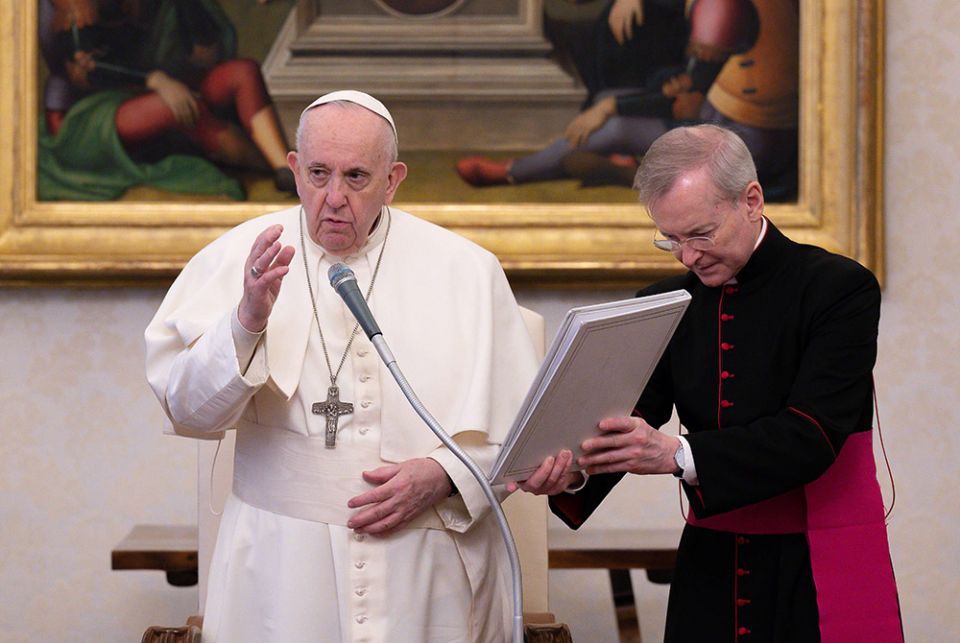 Pope Francis delivers his blessing during his general audience in the library of the Apostolic Palace Feb. 10 at the Vatican. The pope spoke about the importance of daily prayer. (CNS/Vatican Media)