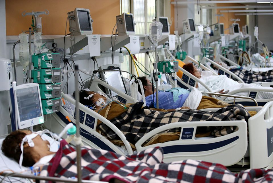 Patients are pictured in the emergency room of the Nossa Senhora da Conceição hospital March 11 in Porto Alegre, Brazil. The emergency room is overcrowded because of the spike in COVID-19 cases. (CNS/Reuters/Diego Vara)