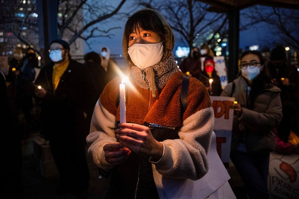 People in Philadelphia attend a vigil in solidarity with the Asian American community March 17. (CNS/Reuters/Rachel Wisniewski)