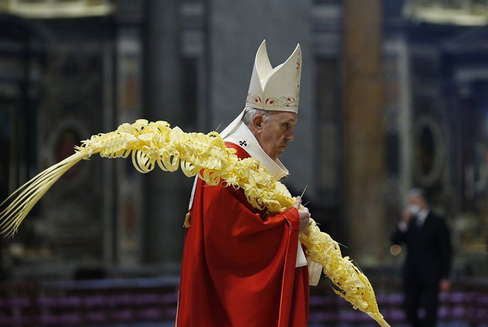 Pope Francis carries palm fronds in procession as he celebrates Palm Sunday Mass in St. Peter's Basilica March 28 at the Vatican. (CNS/Paul Haring)