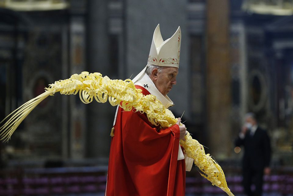 Pope Francis carries palm fronds in procession as he celebrates Palm Sunday Mass in St. Peter's Basilica March 28 at the Vatican. (CNS/Paul Haring) Pope Francis carries palm fronds in procession as he celebrates Palm Sunday Mass in St. Peter's Basilica March 28 at the Vatican. (CNS/Paul Haring)