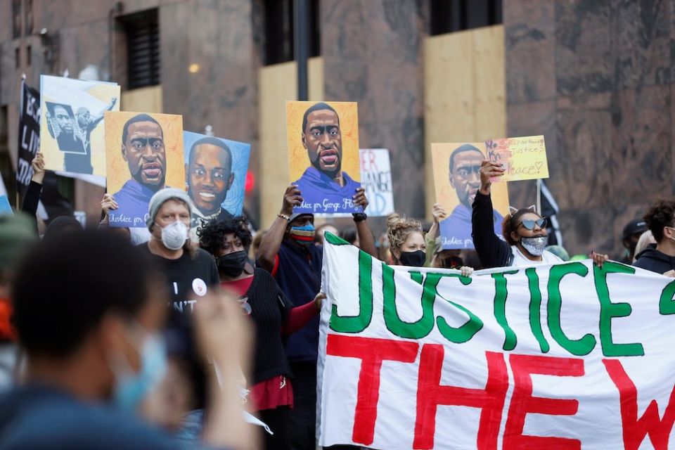 Demonstrators in Minneapolis march on the first day of the trial of former police officer Derek Chauvin March 29. (CNS/Reuters/Octavio Jones)